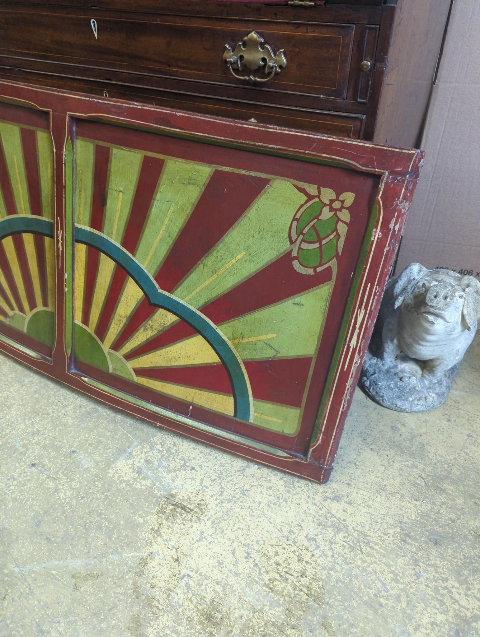 An early 20th century painted wood fairground panel, width 146cm, height 71cm